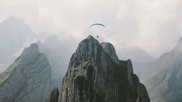 Skydiver over mountain