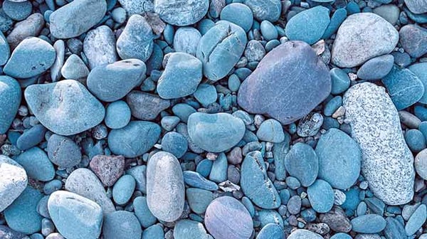 Lots of pebbles in a blue light