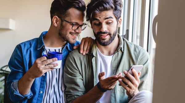 Man pointing at phone