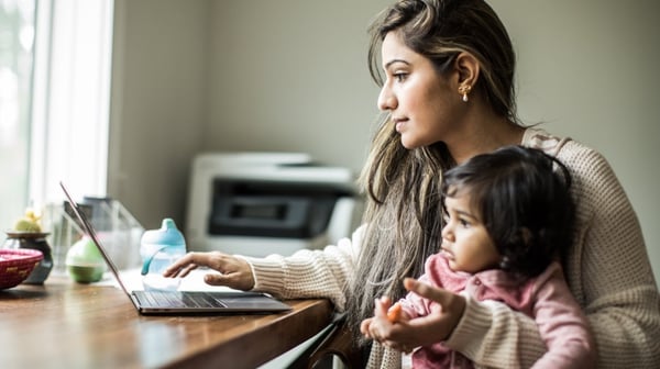 Woman and child looking at laptop