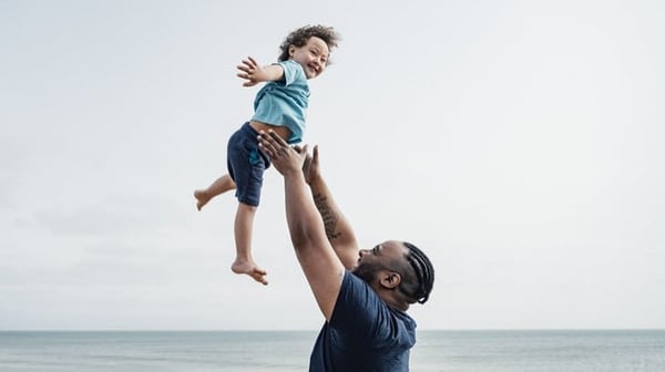 Father holding child in the air